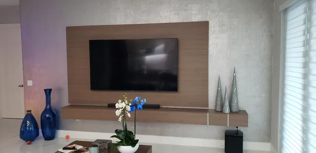 Floating walnut TV panel with LED lighting, Miami living room